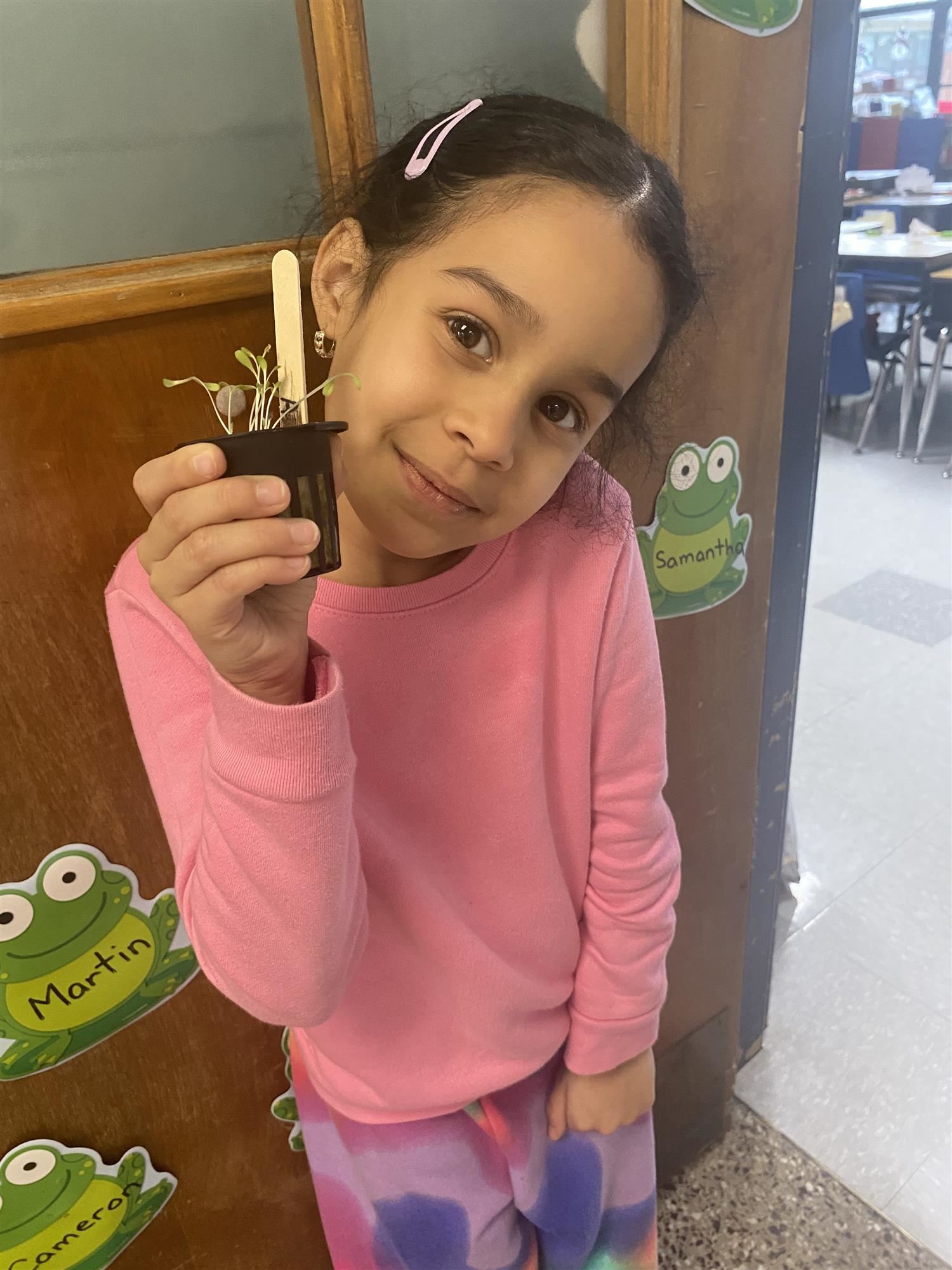 First grader with seedling