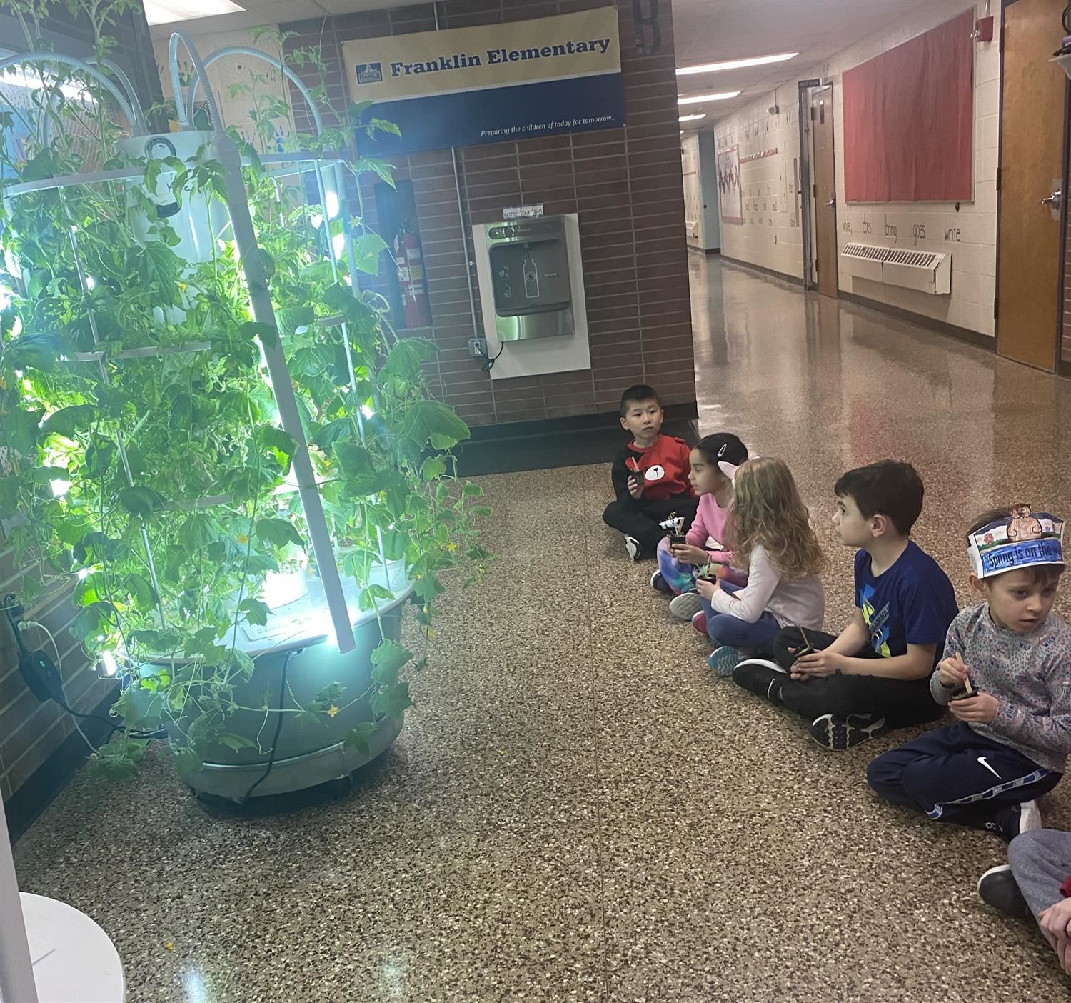 First graders awaiting the aeroponic garden harvest